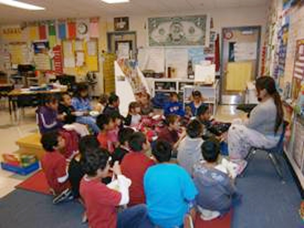 March 2 was Read Across America Day (Dr. Seuss' birthday) and Mrs. Myers class celebrated it. One of many things they did was to listen to Green Eggs and Ham and then cook green eggs and ham with parent helper Mrs. Tovar. As they sat and ate their creation, Mrs. Tovar read the story to them in Spanish.