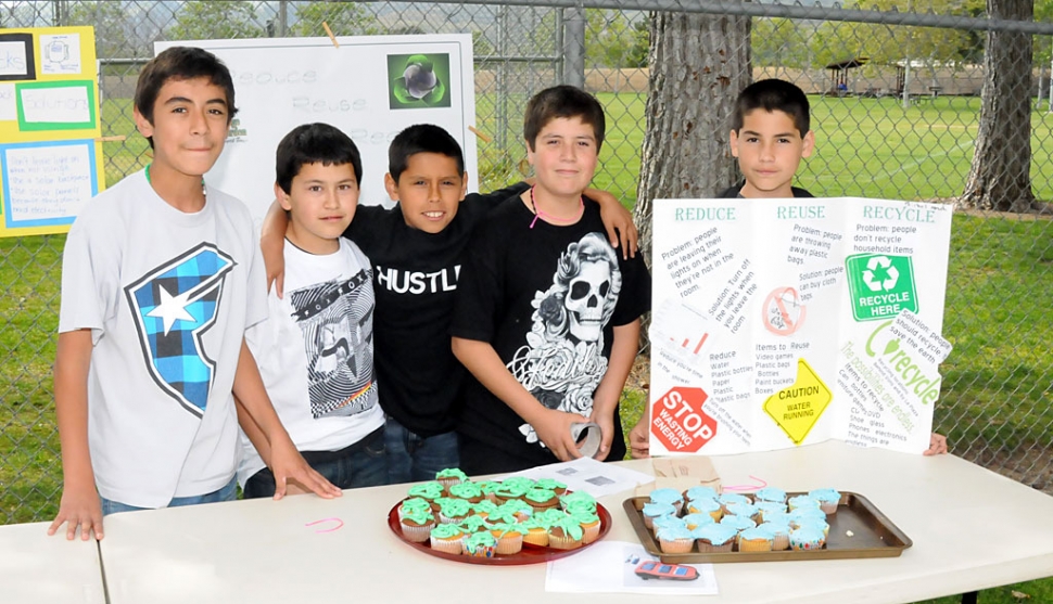 Last week Fillmore Middle School celebrated Earth Day. Above, five students show how you can Reduce, Reuse,
and Recycle, and they also offered cupcakes.