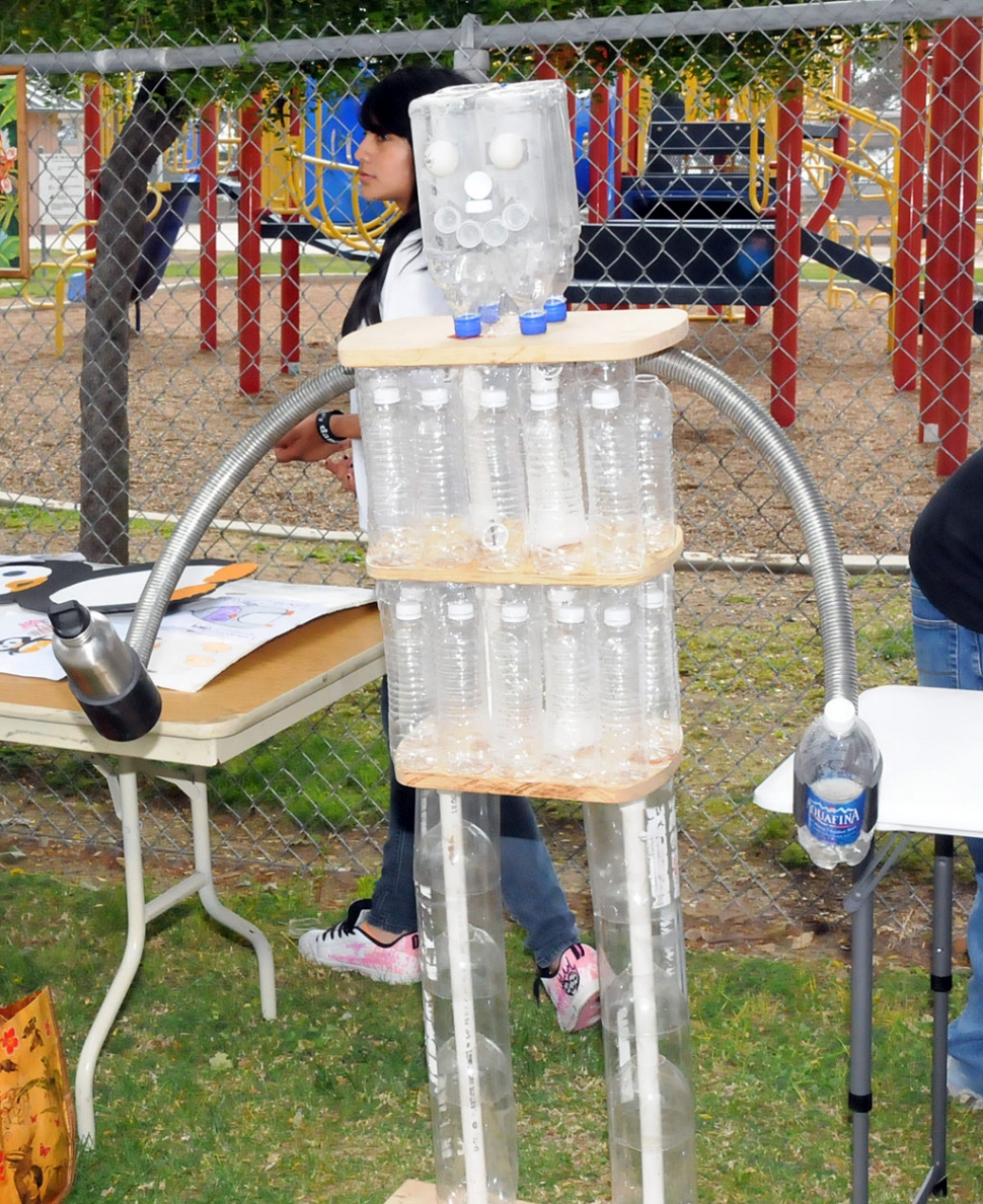 A robot made out of plastic bottles.