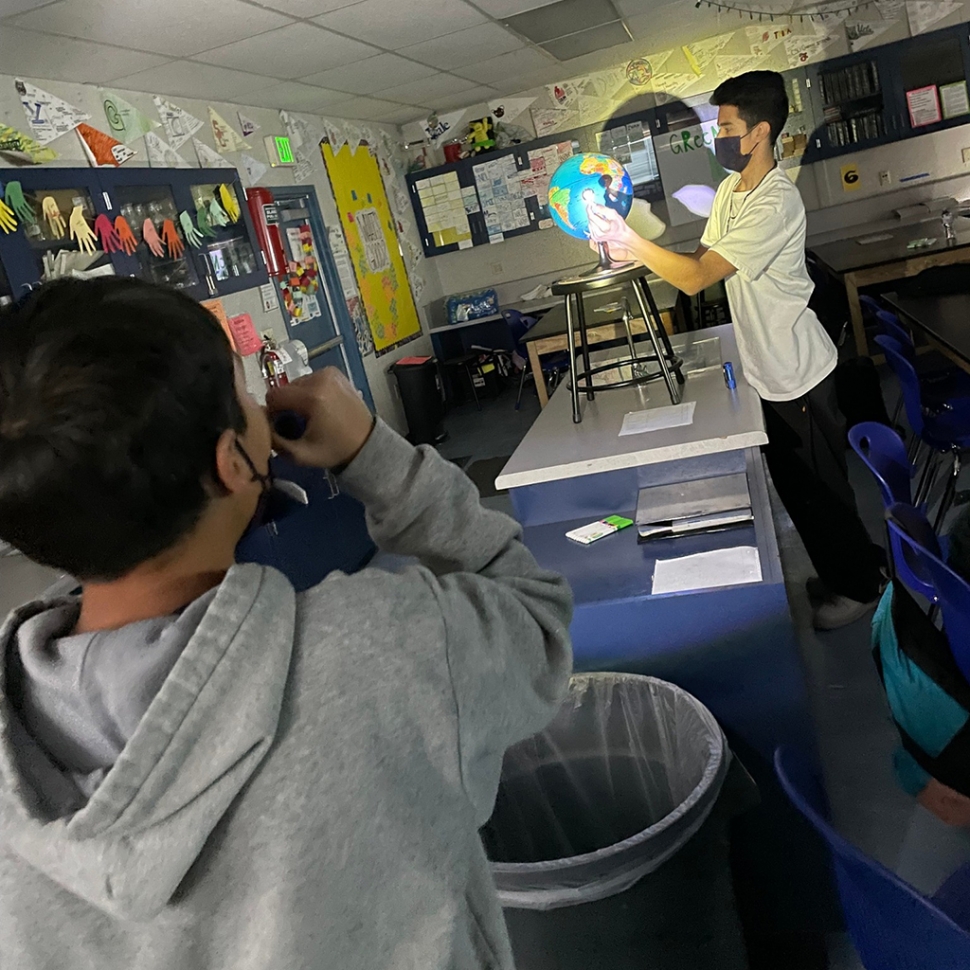 Eight grade students at Fillmore Middle School worked together in groups to create/model and eclipse as part of
science lesson last week. Pictured are some students creating/modeling their own eclipses. Photos courtesy Fillmore Middle School Blog.