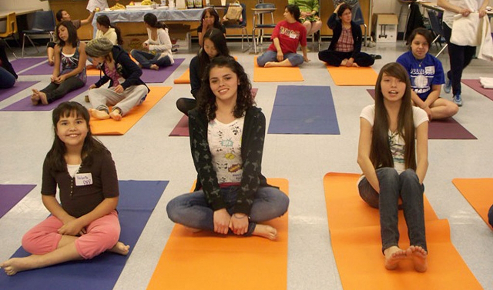 Valeria Villa, Blanca Ayala, and Jenna Mendez all enjoy a yoga exercise.