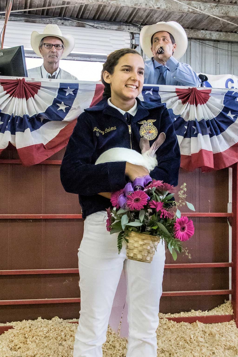 Janaey Cadena of Fillmore FFA pictured with one of her three Reserve Grand Champion Market Rabbits, high bidder paid $1,100 for all three rabbits.