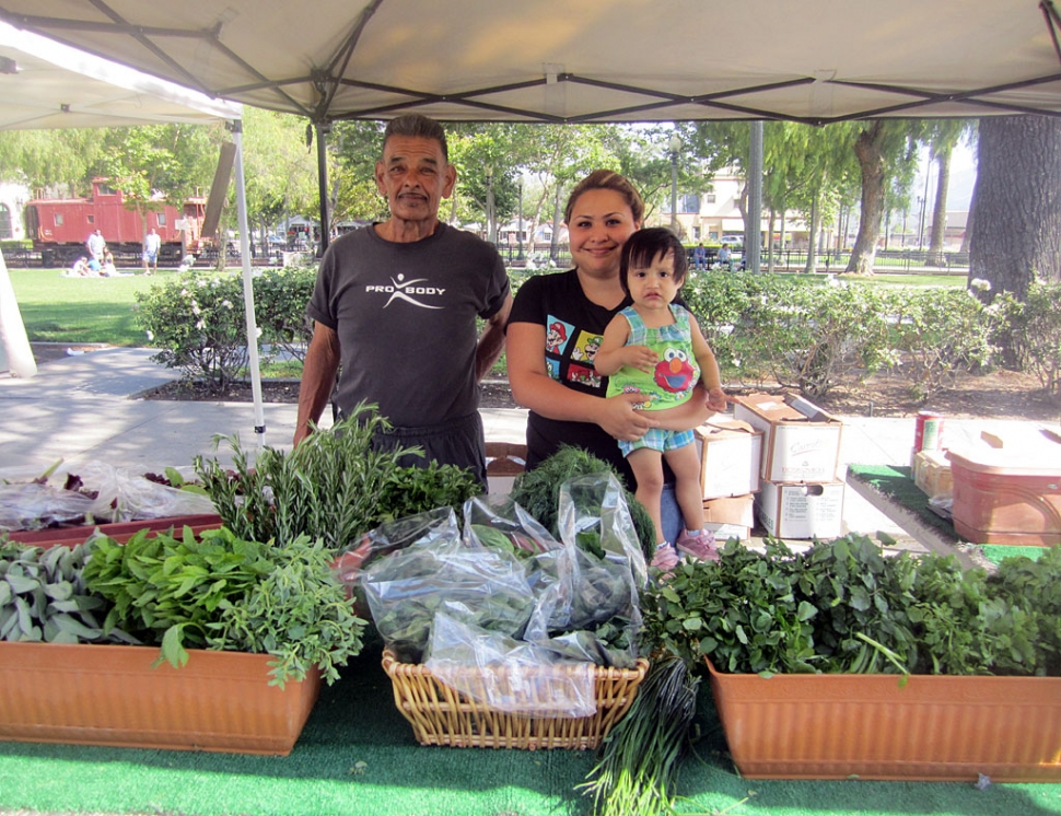 Albert Baltazar with his daughter-in-law Sandra and grand-daughter at the Fillmore Community Farmers Market.