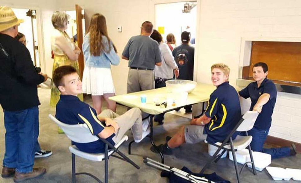 FFA Students smiling as they collect tickets as people lined up to get their breakfast. The Pancake Breakfast is one of the biggest fundraiser FFA hosts all year.