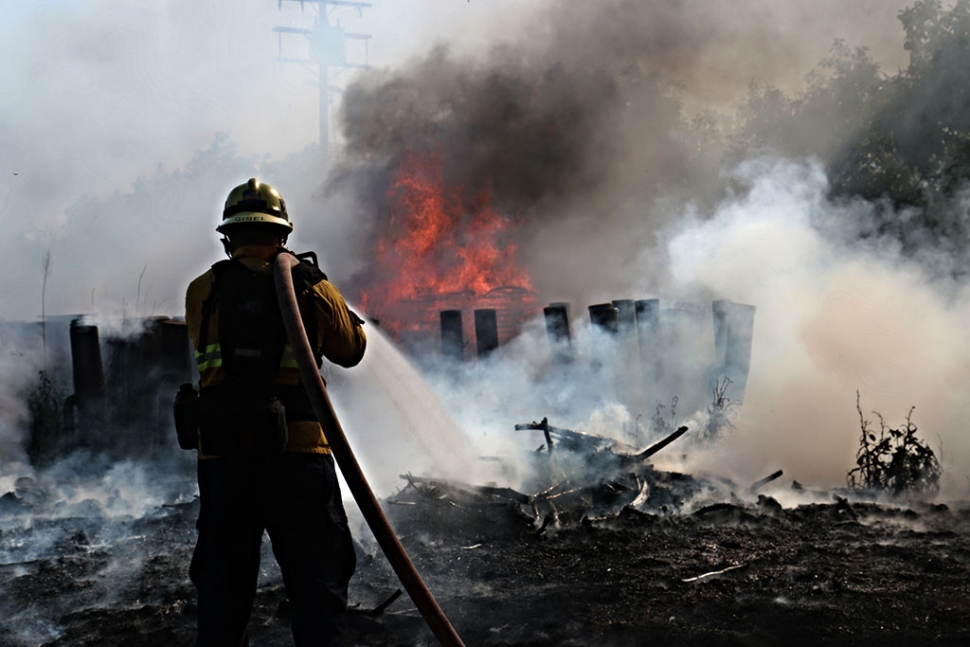 A brush fire on Grand Avenue was quickly extinguished last Wednesday by firefighters. It is believed the fire was accidently started by a dirtbike. Photo by Sebastian Ramirez.