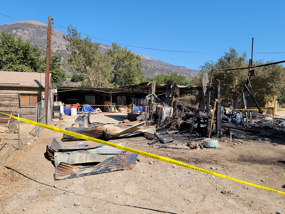 On Monday, July 23, 2021, at 12:05am, the Ventura County Fire Department was dispatched to a reported structure on fire in the 2700 block of Grand Avenue. Arriving fire crews (VCFD RE27) reported a barn fully involved, with exposures threatened with power line hazards. Units on scene also requested Fillmore City Fire to respond to the scene. There were reported diesels tanks on fire; crews were having difficulty in accessing the area with multiple exposures. At 12:30am fire crews were making good progress; fire was knocked down before 12:37am with fire crews remaining on scene for about 2 hours. No injuries were reported at the time of the incident. Photo courtesy Angel Esquivel-AE News.