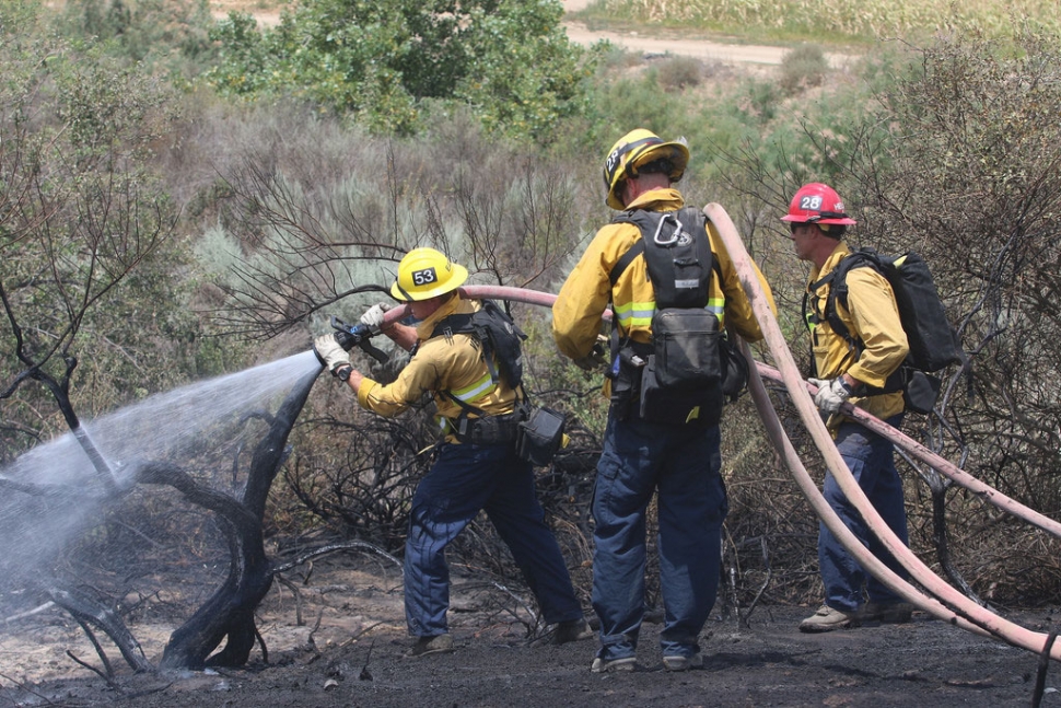 A brush fire in Piru burned about a halfacre Monday. Ventura County Fire Department crews knocked it down within a halfhour with the aid of a helicopter, hand crew, and water tender, along with the Los Angeles County Fire Department. The blaze broke out at noon just off Highway 126 and Camino Del Rio, in the Santa Clara River bottom, near the Los Angeles County line. Heavy brush was consumed; no surrounding crops were affected. Photos courtesy Sebastian Ramirez.