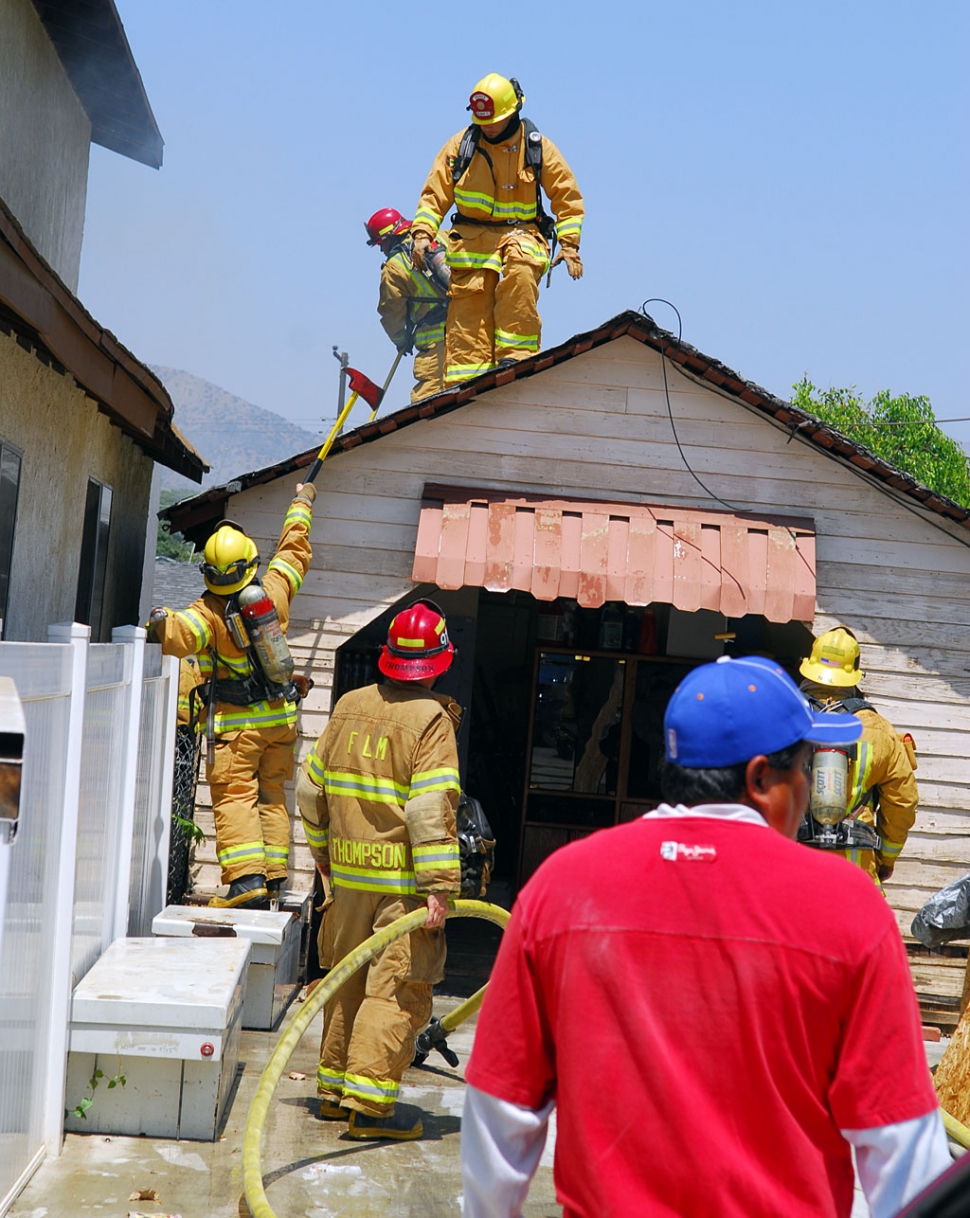 Upon arriving on scene firefighters observed fire and smoke coming from between two structures.