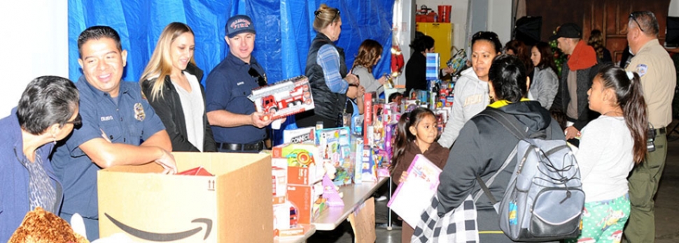 Pictured above is last year’s Annual Holiday Giveaway which will be held Saturday, December 12th from 9am to 12pm at the Veteran’s Memorial Building.