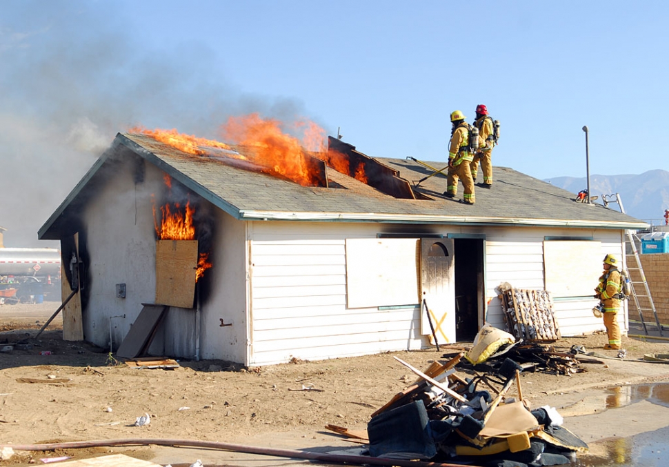 The City of Fillmore Fire Department in conjunction with the Oxnard Fire Department conducted a live fire training exercise on Wednesday, November 4th, at 46 C Street, by the old sewer plant. The abandoned 900-sq/ ft. garage went up in flames as part of a training exercise for the Fillmore Fire Department. The burn provided fire personnel the rare opportunity to obtain hands-on experience with live fire in a controlled non-emergent environment. The process was supervised by experienced personnel and followed strict safety guidelines set by the California State Fire Marshal and the National Fire Protection Agency. The process provided invaluable training experience for fire personnel while simultaneously reducing the cost to demolish the structure.