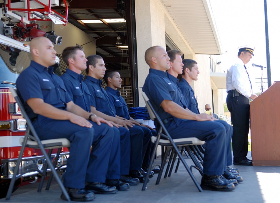 The City of Fillmore Fire Department held its Fire Recruit Graduation Ceremony on Sunday, May 30th at Fillmore Fire Station 91. The event celebrated the successful completion of the fire recruit training and transition to the position of Firefighter/EMT. Pictured are graduating cadets Daniel Mobley, Brian Mercado, Daniel Palmer, Jonathan Torrez, Ryan Kell, Anthony Ventura, and Rudolfo Cortez. The recruit academy lasts six weeks and consists of 168 hours of arduous training. The recruits become proficient in all basic firefighting skills and many advanced techniques including auto extrication and rescue systems. After having successfully passed a 660 hour California State Fire Marshall approved Firefighter academy, recruits are exposed to 168 hours of Fillmore specific training throughout the in-house remedial academy. Many family members and friends attended the ceremony, where refreshments were served. Pictured behind the podium is Fillmore Fire Chief Rigo Landeros.