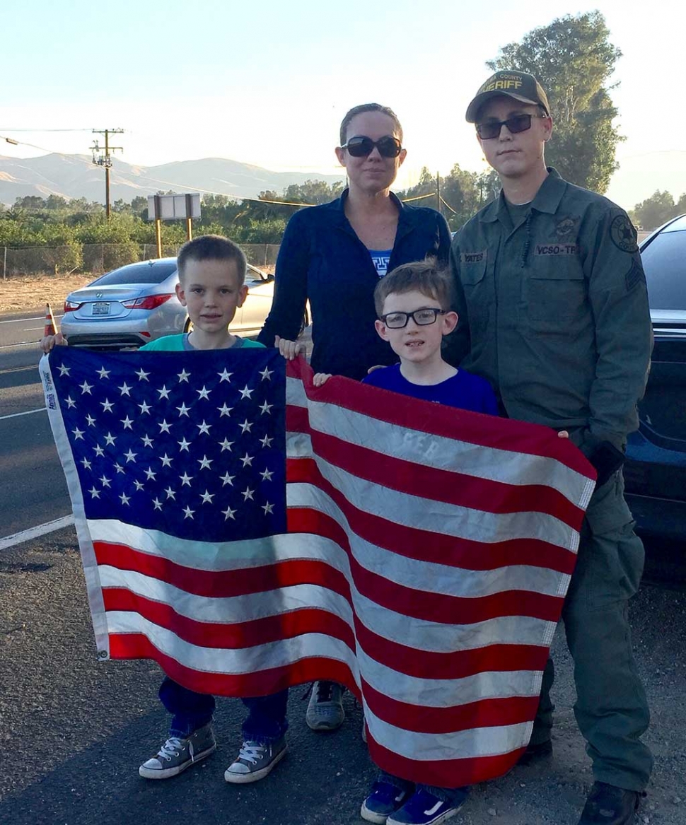 The Yates family of Fillmore, Emerson 9, Jaxson 7, Katie and Meagan, honored Iverson by displaying an American flag. 