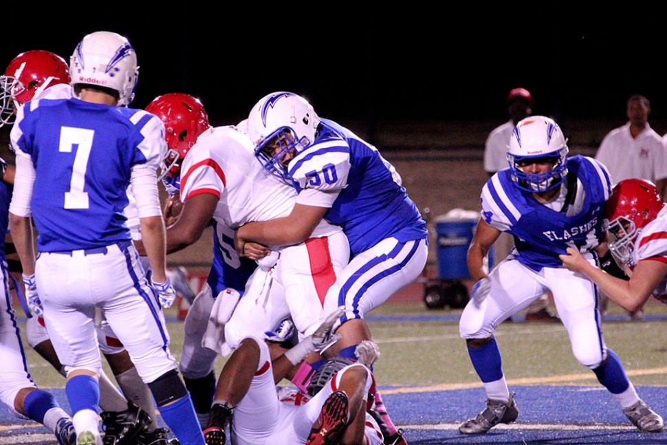 Varsity #50 Omar Valdivia makes a tackle