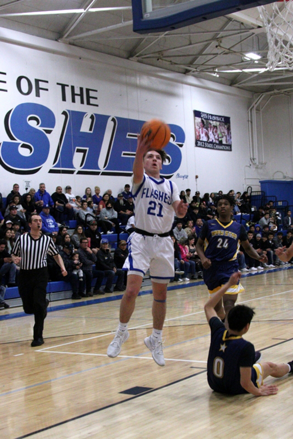 On Wednesday, February 8, Fillmore hosted their first round playoff game against Mary Star of the Sea. Pictured above is Flashes #21 as he gets past the defense to drive to the basket. Fillmore beat Mary Star 54-49. Photo credit Crystal Gurrola.