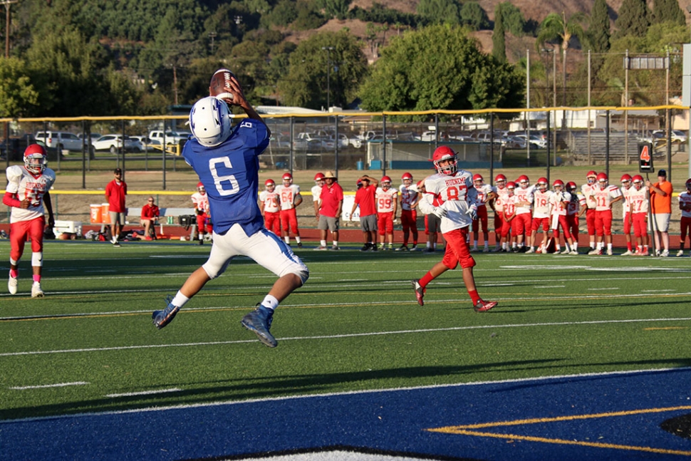 (above) Fillmore Flashes JV #6 leaps into the air to make the touchdown catch and score for the Flashes. The Flashes got back in the win column this week, with their 38-0 win over the Hueneme Vikings on Saturday night. Even with the odd schedule predicated by Edison shutting off power, the Flashes defense stood strong with interceptions by junior DB Ty Wyand and senior linebacker Dylan Crawford. Ty Wyand and sophomore safety Phillip Cervantez also had fumble returns for touchdowns on defense. On offense, senior running back Bryce Nunez ran for 115 yards and a touchdown, while junior receiver Dylan Sierra added 7 catches for 80 yards and a touchdown. Lastly, Flashes JV defeated Hueneme with a final score of 28 to 6. JV will host Nordhoff Thursday, October 17th at 5pm. Next week the Flashes Varsity will be off this week. Their next game is on 11/1 at Santa Paula. Submitted by Coach Sean Miller, photos courtesy Crystal Gurrola.