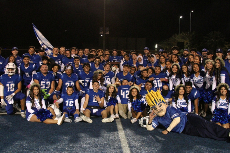 On Friday, October 28th, the Fillmore Flashes defeated long standing rival Santa Paula for their 111th meeting of the
teams. Above are the Varsity Football and Cheer teams celebrating after the big win and being named Citrus Coast
League Champs which allows Fillmore to advance to the Playoffs this Friday, November 4th against Santa Ana High
School in the first round of CIF Playoffs. Photo credit Crystal Gurrola. Additional details courtesy Max Preps: On Friday, October 28th, the Fillmore Flashes defeated long standing rival Santa Paula in their 111th meeting of the two teams. After a long, hardfought game between the teams the final score for the varsity game was 35 – 28, JV lost to Santa Paula 2 – 7. The Flashes varsity also claimed the title of League Champs, going undefeated in their league (Overall record 8 – 2; League record 4 – 0). This win allows the Flashes to advance to the 2022 CIF Southern Section Playoffs Bracket and will play away against the Santa Ana at the Santa Ana Bowl Stadium 662 N. Flower St., Santa Ana 92723. (Overall record 7-3) on Friday, November 4th, at 7pm.