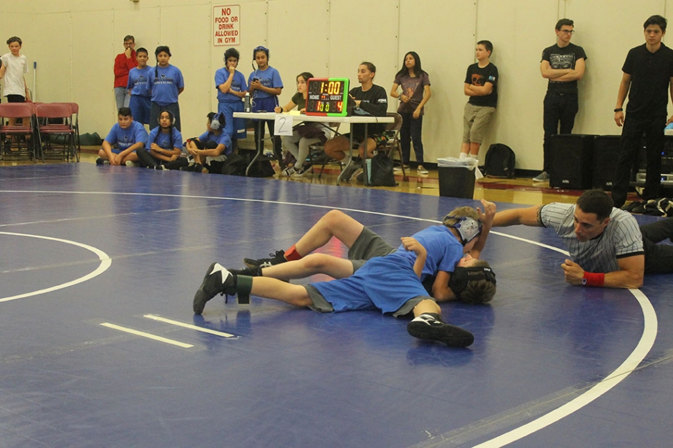 Pictured above is James Zellmer taking his opponent to the mat in his match at Balboa Middle School last week, James finished with a record 1-0. Last week the Fillmore Middle School Bulldogs Wrestling Team competed at Balboa Middle School in Ventura, the results are as follows: Devin Camacho 0-1, Erik Castaneda 0-1, Jonathan Patino 1-0, James Zellmer 1-0, Delilah Cervantez 0-1, Natalia Herrera 1-0, Amalia Nolan 1-0 (pin), Emma Torres 1-0 (pin). The team competed against athletes representing Balboa, Isbell, and Sinaloa middle schools. The team will next compete at Isbell Middle School. [Story and photos courtesy Coach Michael Torres]
