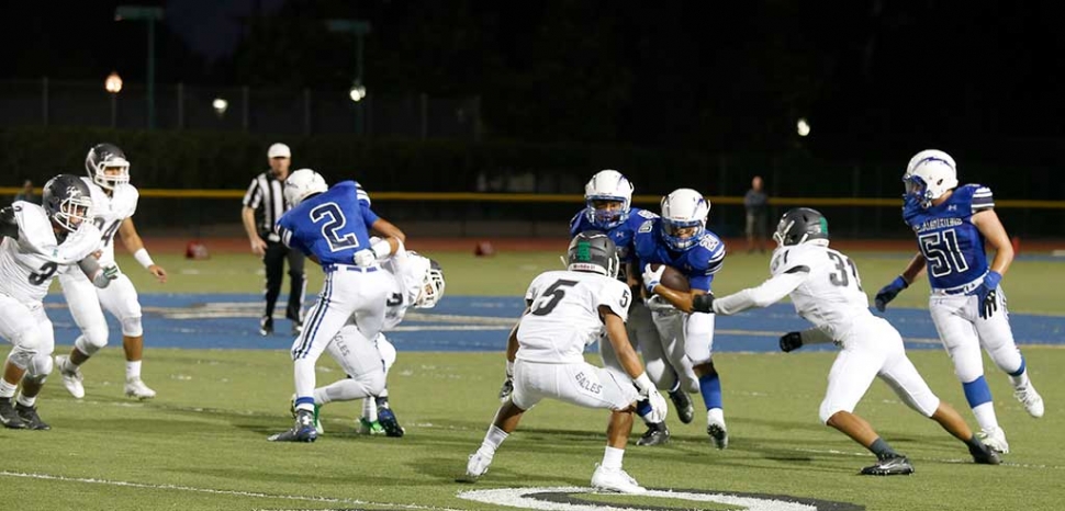 Fillmore’s Running Back #20 Ricky Holladay runs past the defense at this past Friday’s game