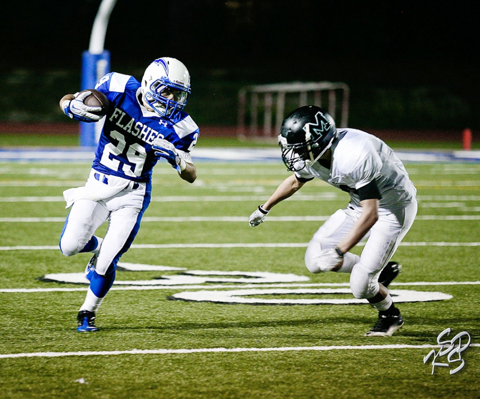 Mario Hernandez makes his way around Malibu for a few yards, during last Friday’s game.