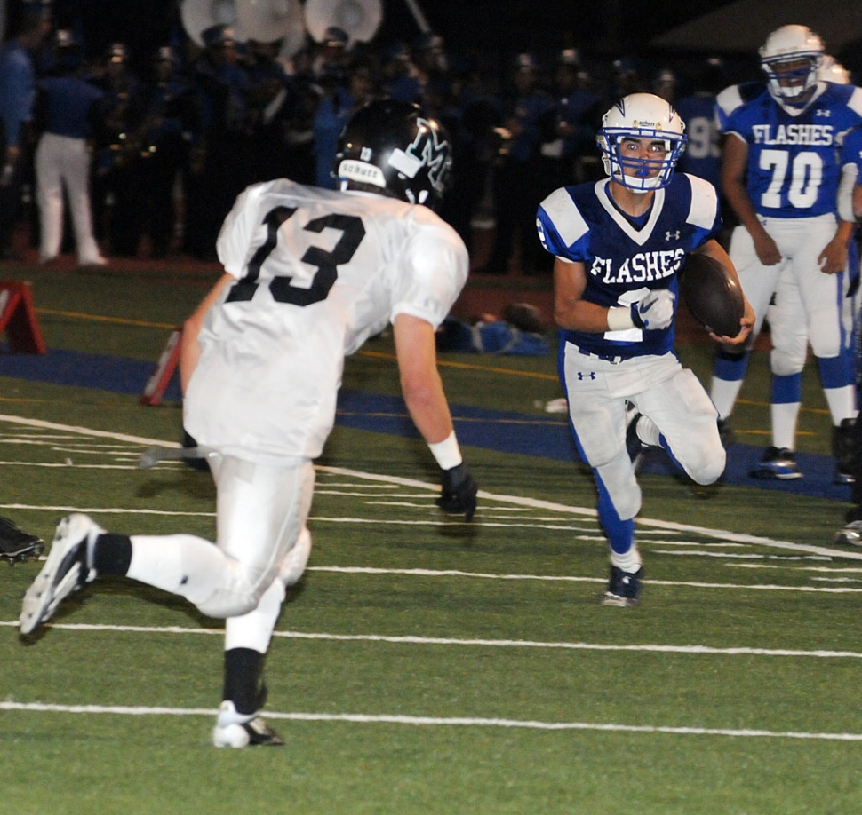 Robert Bonilla (#2) runs the ball down the field agains Malibu. Bonilla rushed 10 times for 51 yards. He also had an interception.