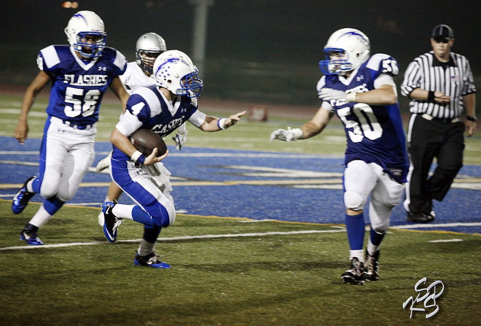 Collin Farrar #4 had 26 carries for 233 yards, and 4 touchdowns against Frazier Mountain. The team broke the
school’s scoring record which was set in 1981 against Moorpark, 57points. This year’s team scored 59 points Friday night against Frazier. Coach Dollar stated, “ We came out slow because of the delay, the second half we played some of the best football we have played all year.” [Photo’s by KSSP Photographic Studio]