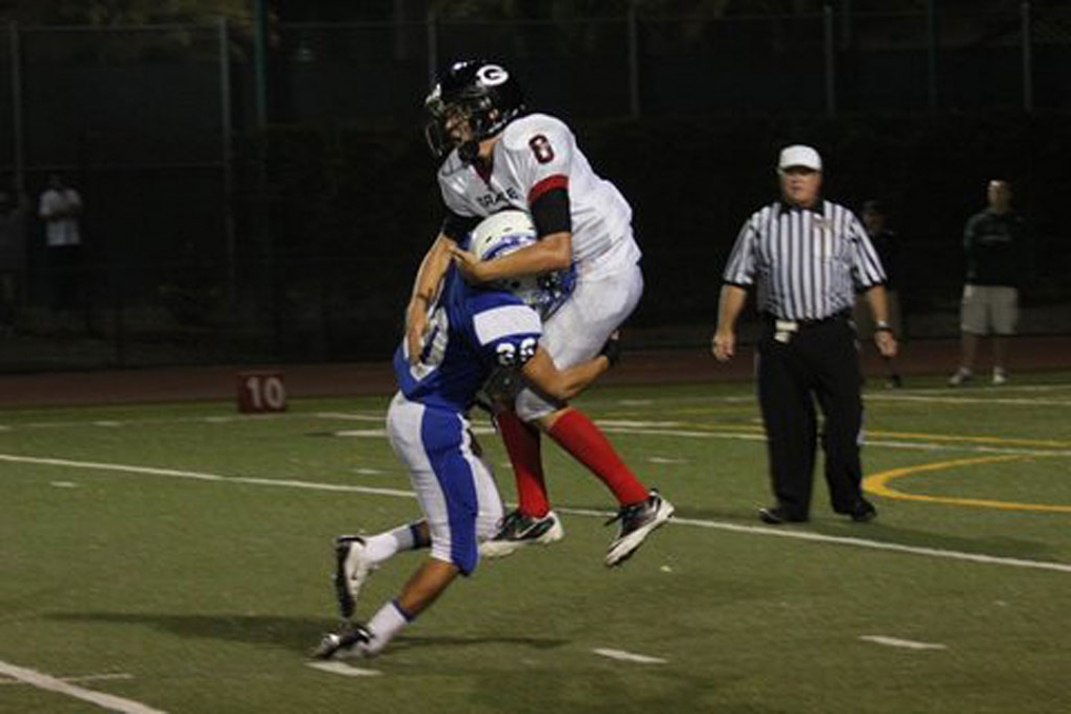 Flashes defeat Grace Brethren 27-6. “It was a big win for us, to open league with a win will create momentum for the rest of league.” Collin Farrar had 24 carries for 126 yards, Jeremy Martinez had 18 tackles. (above) #20 Adam Jimenez plows into a Grace Brethren player.