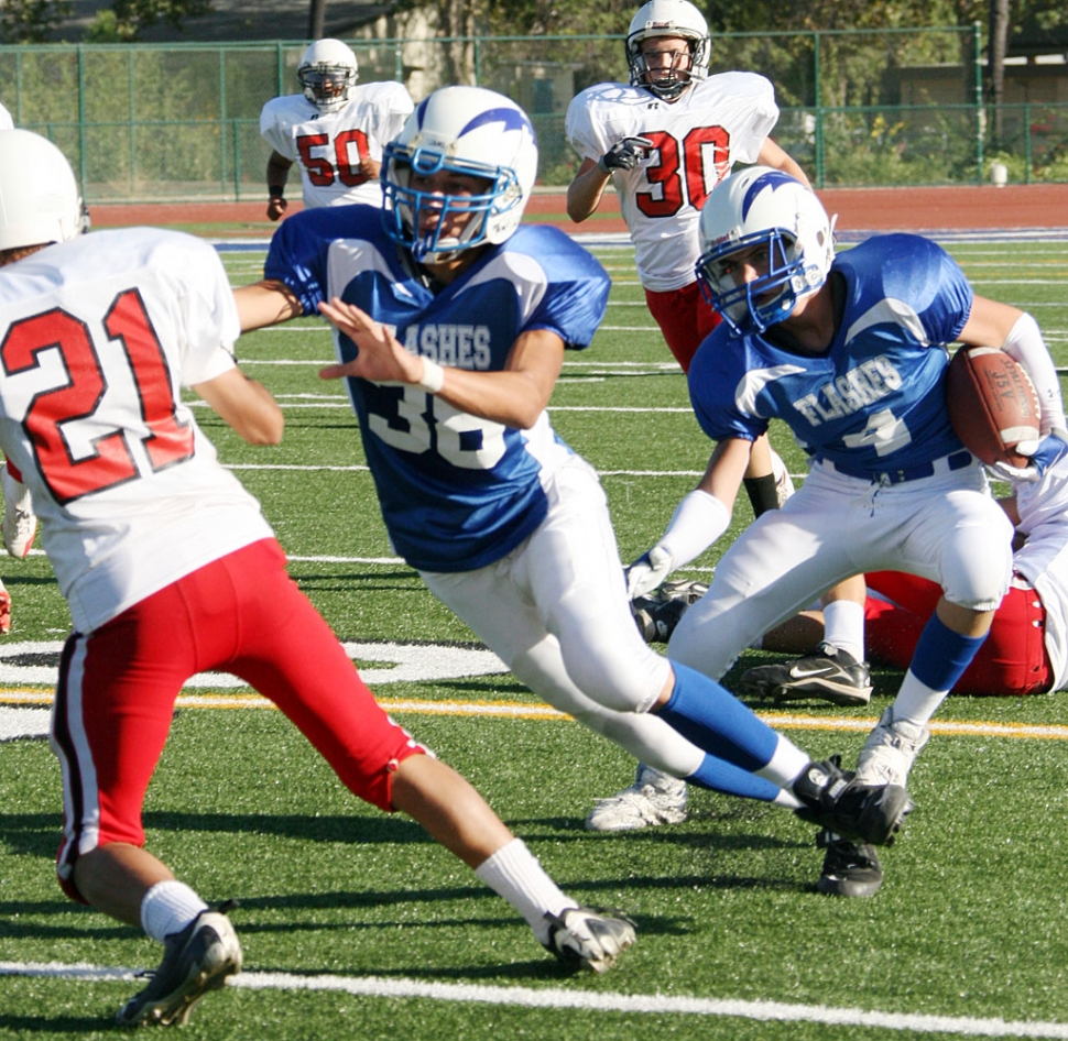 Collin Farrar makes a move to score a touchdown, Farrar scored 2 along with Robert Bonilla. On Defense, Johnny Wilber and J.P. Galvez played well.