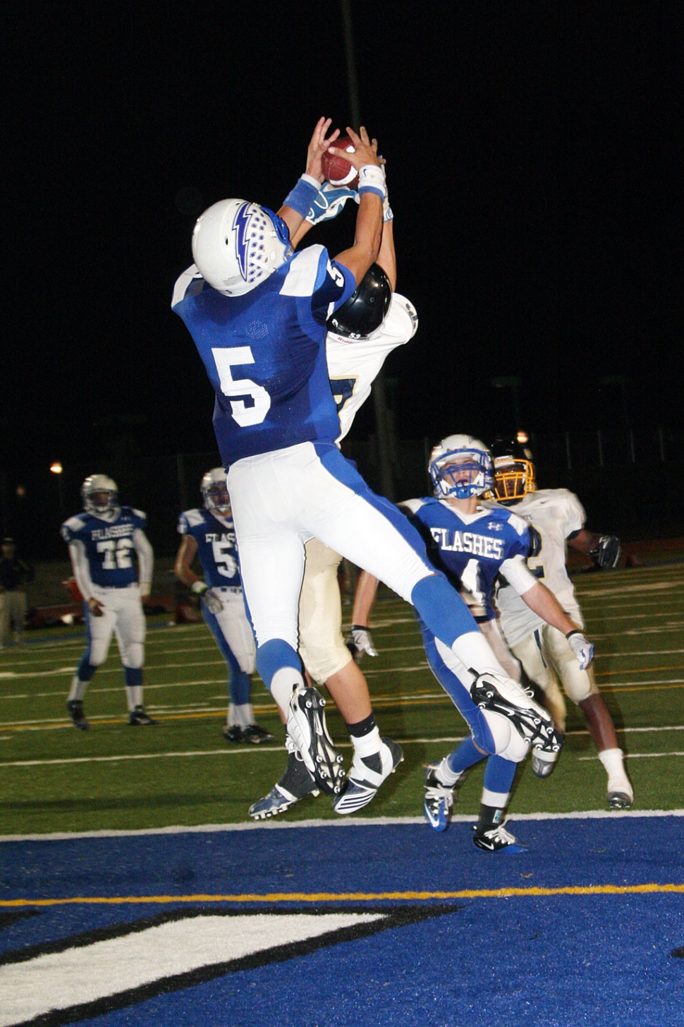 Chris De La Paz #5 takes the ball out of the hands of a Saints player. De La Paz had 9 catches for 158 yards. Coach Dollar said, “ Corey and Chris both had a great game. Chris broke his own single reception record, and Golson made many great defensive plays including two key interceptions. Davis owned the line of scrimmage.”