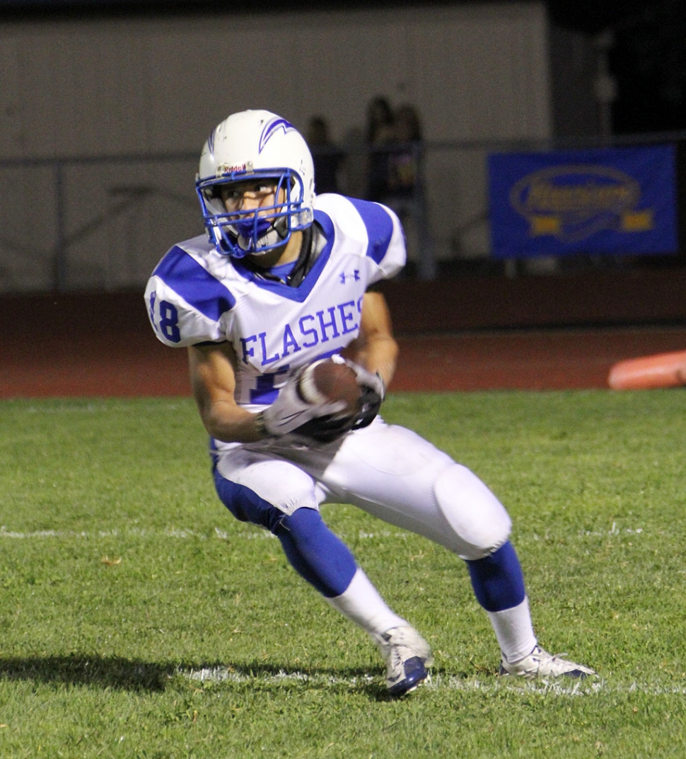 Andre Sanchez #18 runs the ball for a few yards against Nordoff. 