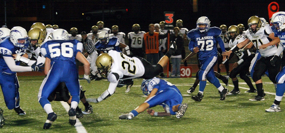 Above Nick Paz stops Yucca Valley from gaining a first down. Paz had 4 touchdowns: two rushing and two receiving, he finished the night with 15 carries for 117 yards.Corey Cole was 5/7 for 146 yards and 4 touchdowns, he also broke the season passing TD record held by Steve Dann set in 1974 at 12, Corey is now at 13 this season. Chris Delapaz had an 85 yard TD reception. Zach Golson had a 38 yard TD reception. Derek Luna had 17 tackles and Dylan Dawson had 15 tackles. Both Dylan Dawson and Brandon Nelson had fumble recoveries. According to Coach Dollar, “This was a great way for us to start the playoffs, both Offense and Defense played well”. Fillmore will be traveling to Bishop High School this Friday for the second round of CIF Play-offs. Photos Courtesy of Crystal Gurrola.