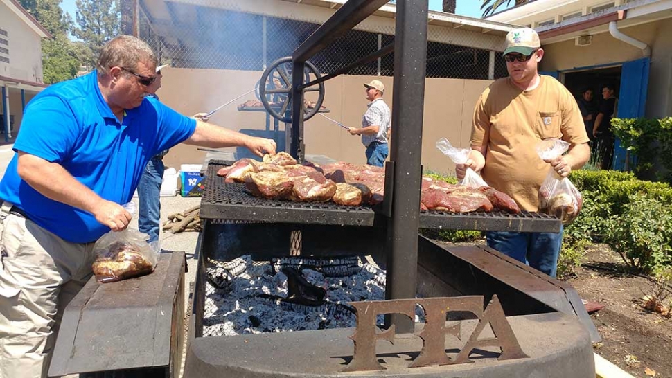 Fillmore’s FFA hosted a Tri-tip Barbecue Fundraiser for Fillmore High School’s Football Team. Pictured above are Dave Wareham and Andrew Klittich getting the tri-tip on the grill. They barbecued about 190 pieces of tri-tip. Photo Courtesy Sebastian Ramirez.