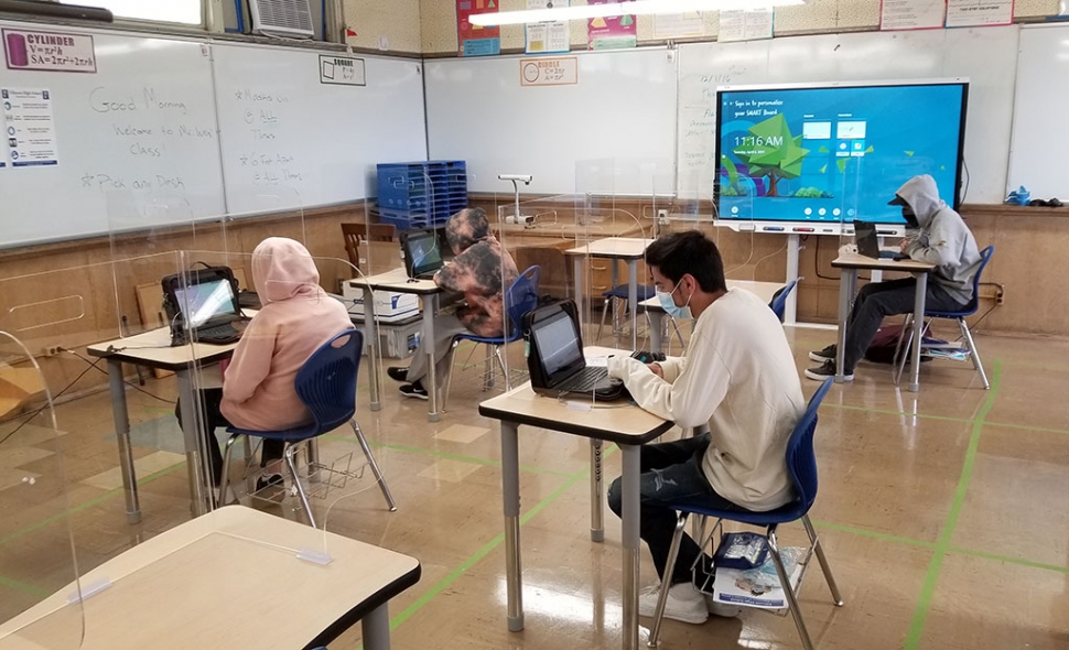 On Tuesday, April 6th, Fillmore Unified reopened its doors for in-person learning. Schools closed down in March of 2020 due to the COVID-19 pandemic and now they are slowly reopening. Students and staff are on a schedule where some students do both in-person and distance learning during the week. Above are students at Fillmore High sitting physically distanced in Charlie Weis’ mathematics class.