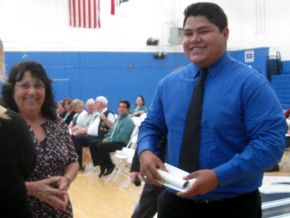 The Fillmore Women's Service Club presented three Community Scholarships this June. At the Fillmore High School Awards night Mimi Burns presented Rafael Reglado a scholarship on behalf of the members. Rafael plans to get a degree in Business and eventually open his own business.