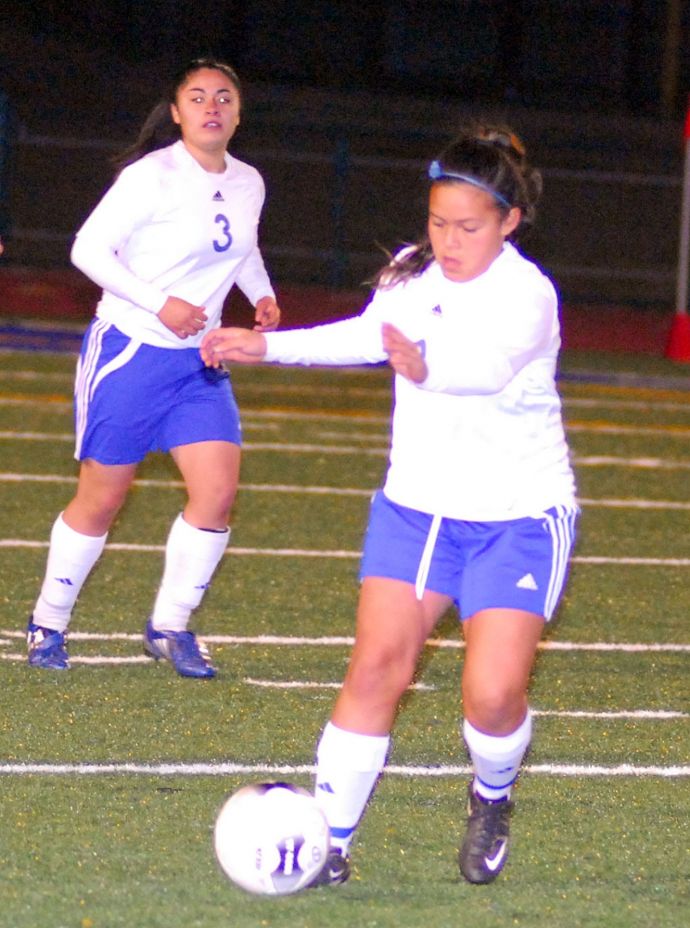 Jasmine Medina show great control against Oak Parks defense. Also pictured Maria Juarez #3.