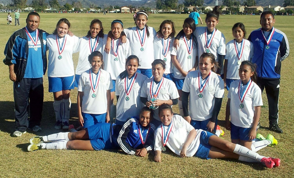 (l-r) top row: Coach Omero Martinez, Rachel Rivera, Jada Avila, Yuliana Magaсa, Emily Garnica, Taylor Flores, Esmeralda Murillo, Brianna SantaRosa, Jocelyn Muсoz, Coach Arnold Muсoz. bottom row: Grace Topete, Fernanda Magaсa, Caroline Esquivel, Calista Godfrey-Vaca, Ana Rincon, Reylene Martinez, and Yaneli Enriquez.