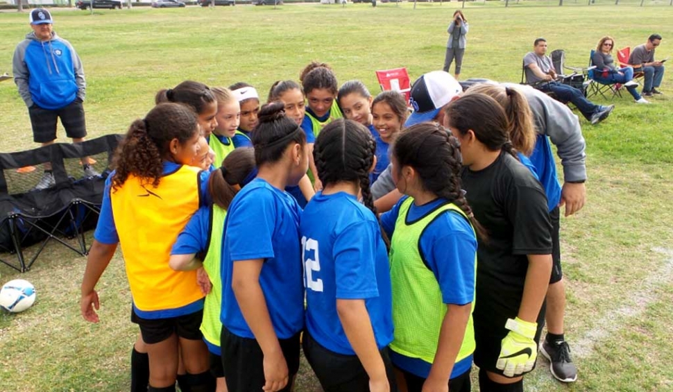 California United Girls 11-U team looking confident as they prepare to take the field after a team break. Photo Courtesy Evelia Hernandez.
