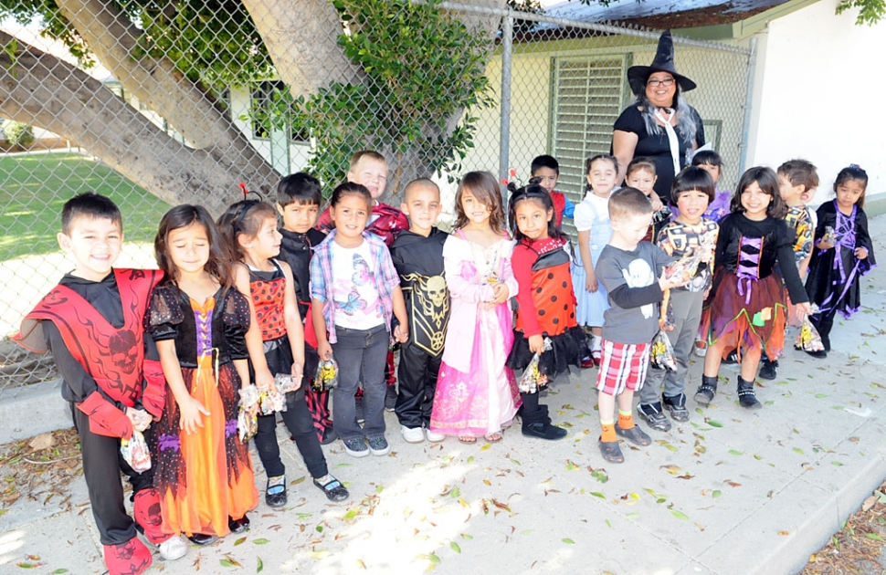 Ms. Vasquez and her kindergarden class walked to Santa Barbara Bank & Trust for treats on Halloween day. On their way back they stopped by the Fillmore Gazette for a photo.
