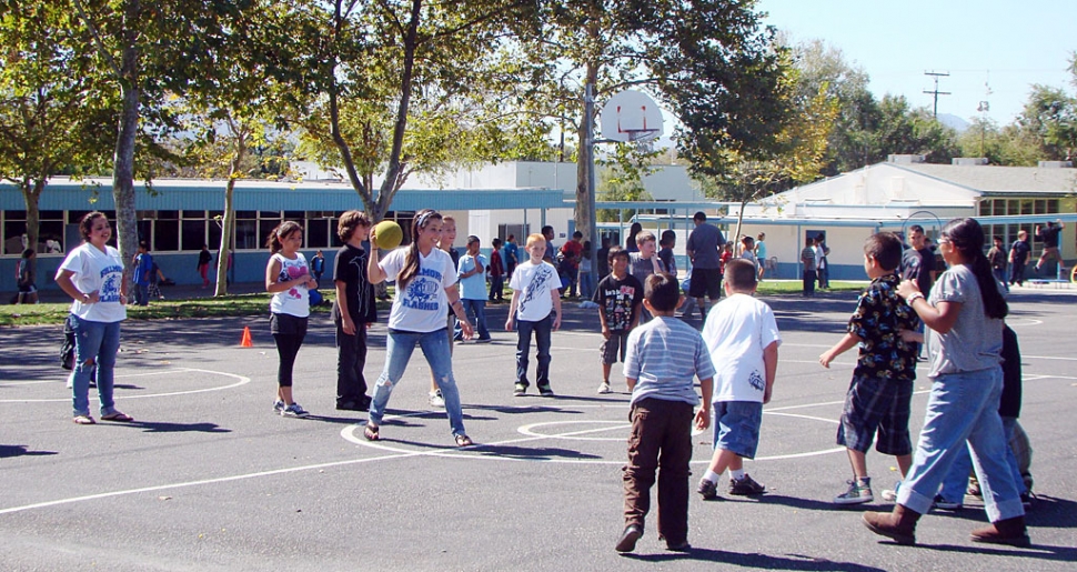 Fillmore High School Warriors doing PE activities with San Cayetano students. At the end of each school quarter the FHS students come as a reward for good readers during the lunch recess.