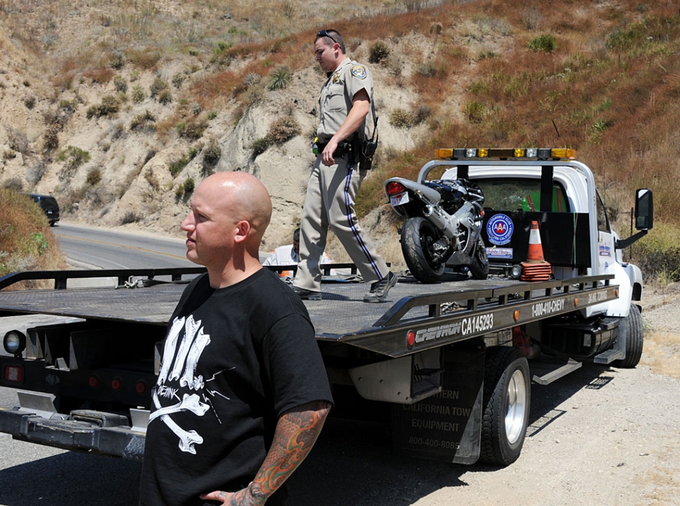 A hit & run occurred Tuesday on Grimes Canyon Road at approx. 2pm. A white Ford SUV driven by a Hispanic male, about 30 years old, crossed over into the southbound lane and hit a motorcyclist, pictured above. The rider was slightly injured. The Gazette is offering a $100 reward to anyone providing information that leads to the arrest and conviction of the hit & run driver.