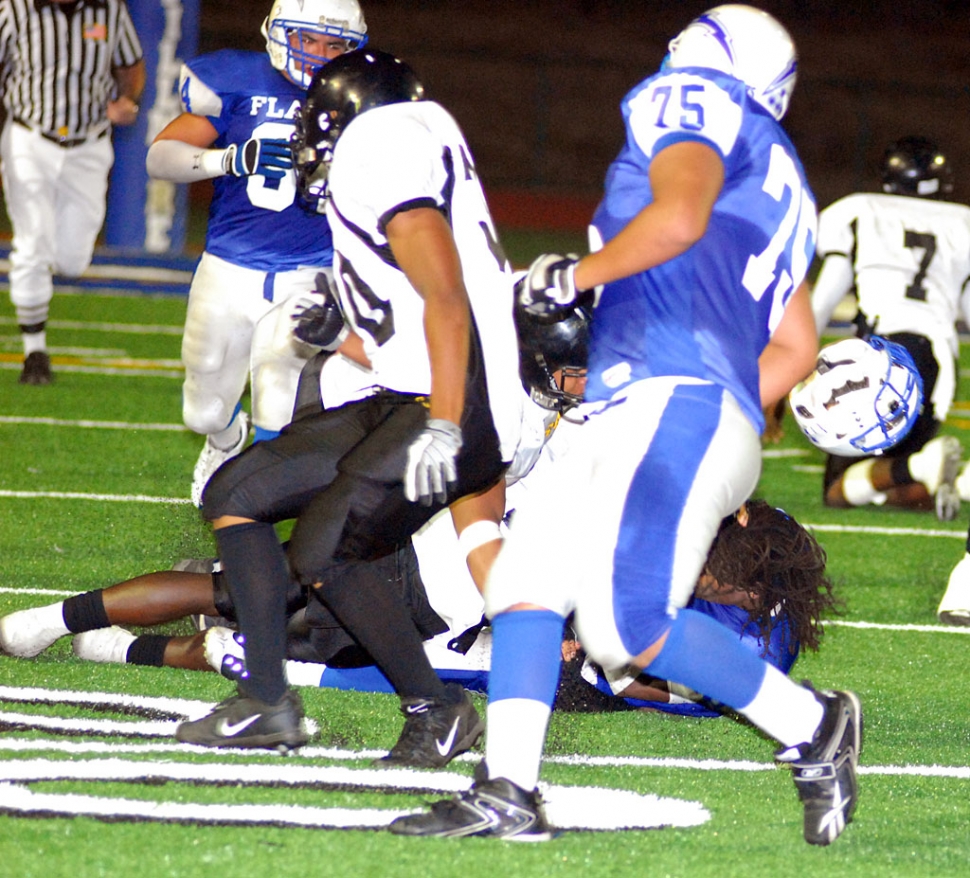 Troy Hayes helmet flies off after being hit by Kilpatrick defense. Hayes had over 200 rushing yards.