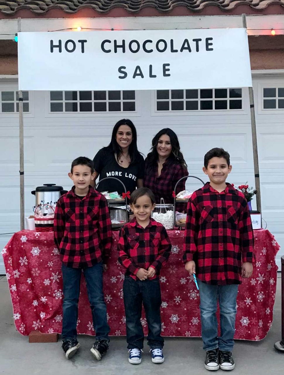 For the past 3 years Brendan Morales, mom Laura Morales, his best friend Colby Satterfield, mom Teresa Satterfield along with their uncle Christopher Zavala (not pictured) have made a large donation to the Fillmore Fire Departments Annual Toy Drive. The boys set up a stand in their driveway offering hot chocolate, goodies and arts and crafts for a donation. This year they were able to raise $730 for this good cause. Photo courtesy Sebastian Ramirez.