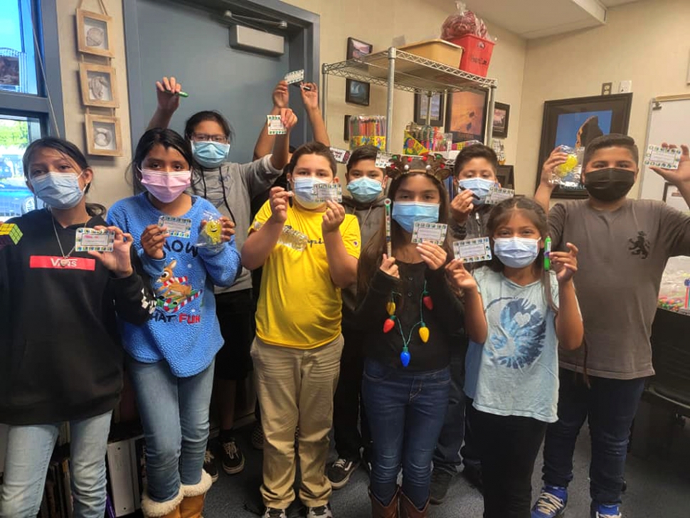 Mountain Vista students celebrate their i-Ready success holding up their prizes from Carl’s Jr. Courtesy Mountain Vista Elementary Facebook page.