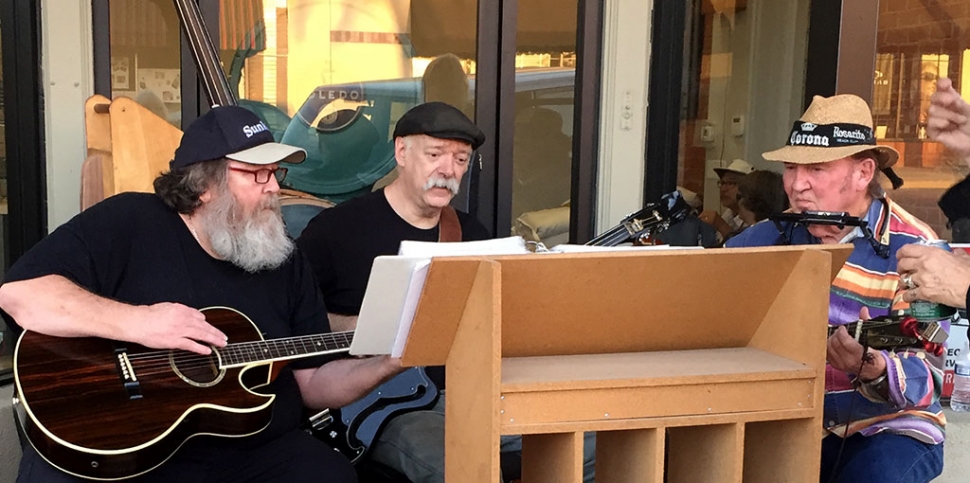 Pictured (l-r) are John, Bruce and Jim jamming in front of Roan Mills Bakery last Friday night. Photo courtesy Katrionna Furness.