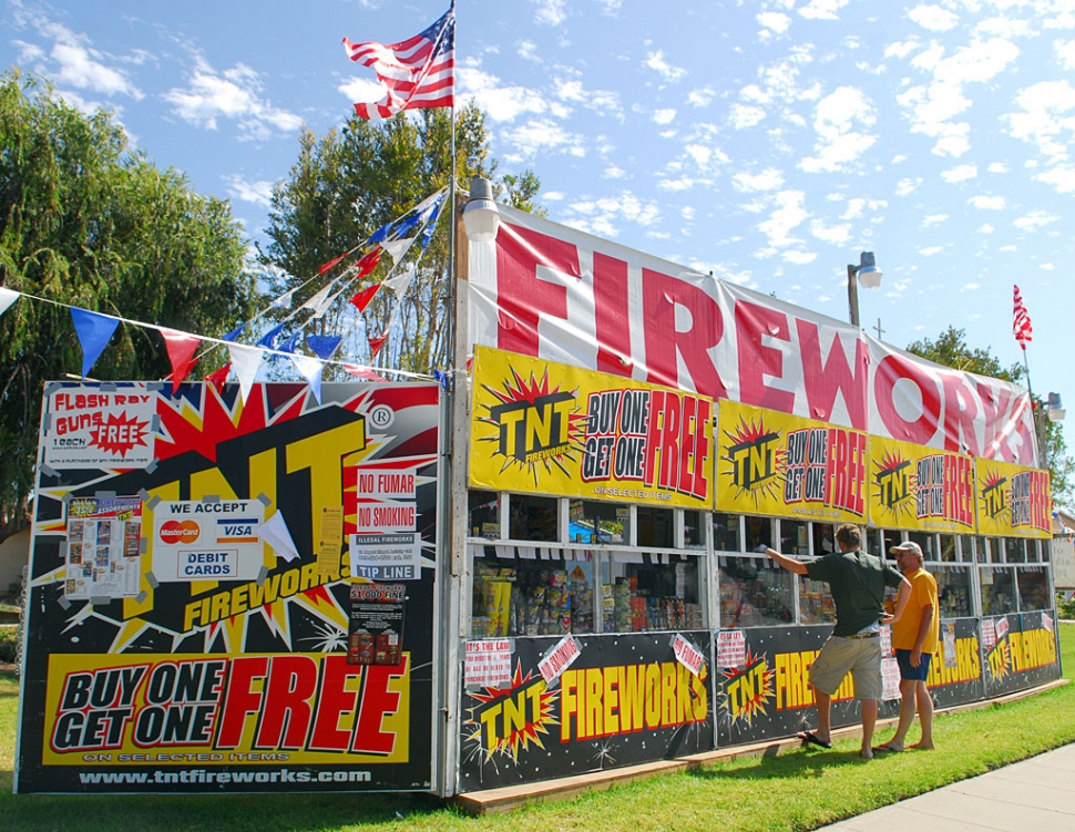 It’s that time of year! The City of Fillmore is offering Safe & Sane fireworks for sale through numerous local non-profit organizations. Shown is the Saint Francis of Assisi fireworks booth making some sales. So find your favorite booth, see list page 2, and buy, buy, buy! Go to http://www.ca-fireworks.presskit247.com/content/content-article.asp?ArticleID=494 for list of all 247 California cities selling fireworks this year.