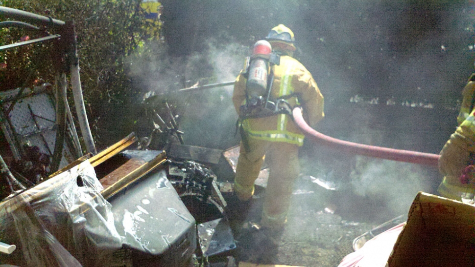 Firefighters made quick work of the blaze extinguishing it in less than 5 minutes and minimizing damage to personal property the resident had placed in the front yard. 