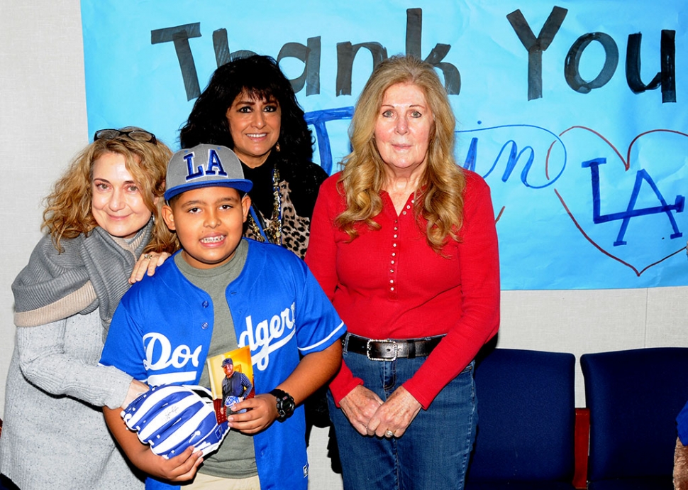 Pictured is Miguel Martinez (center) a 6th grader from Fillmore Middle School who received a signed baseball glove and photo from Justin Turner of the Los Angeles Dodgers. Also pictured is FUSD Assistant Superintendent of Educational Services Micheline Miglis (left), District K-12 Counselor Norma Pérez-Sandford, and Support for the Kids Founder Lynda Miller (far right) who presented to the glove to Miguel on December 13th, 2019.