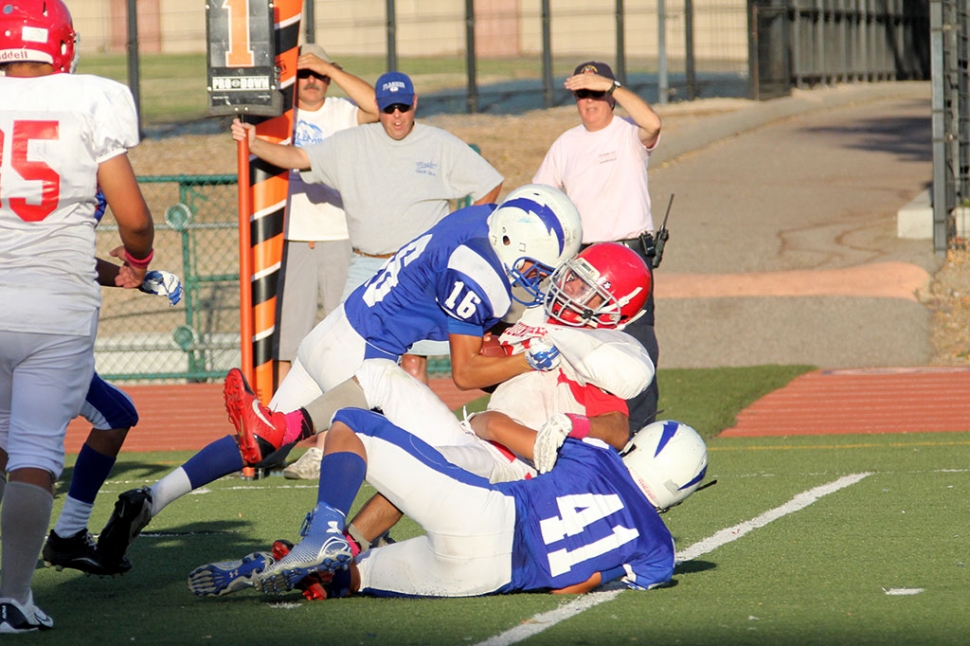 J.V #16 Saul Santa Rosa and # 41 Cameron Holmes make a tackle. Photos courtesy Crystal Gurrola.