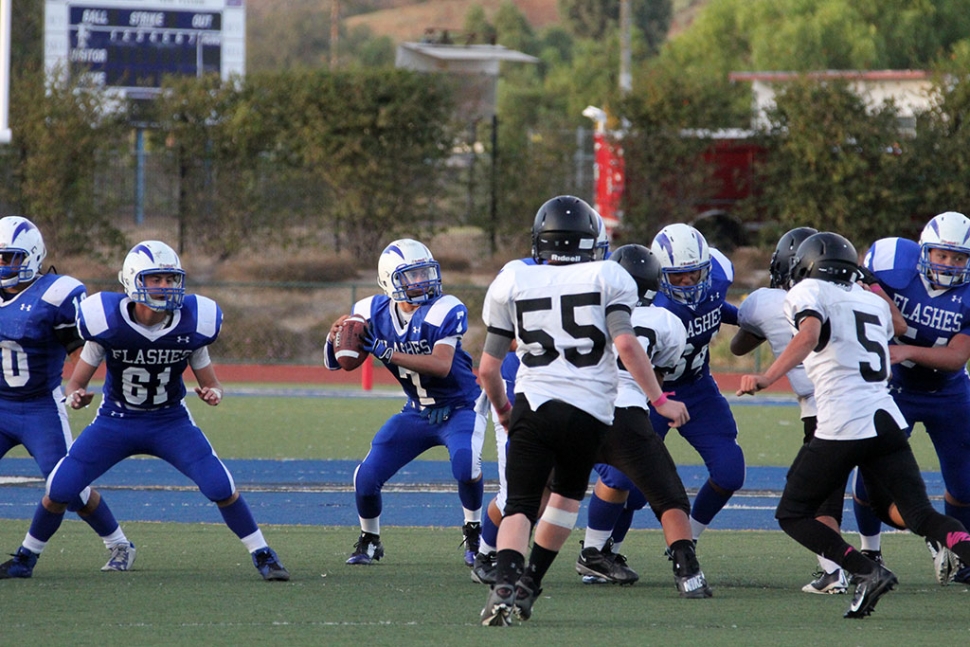 #7 quarterback Hector Sanches Completes a touchdown pass while getting some protections from the offensive line. Photos courtesy Crystal Gurrola.