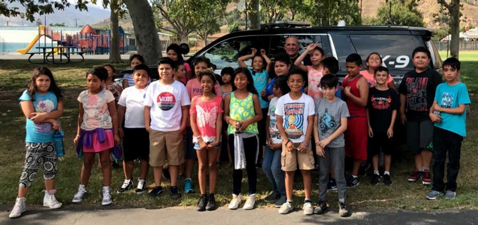 Officer Allen Macias and his K9 partner Ace, from Santa Paula Police Department, visited San Cayetano school on Friday, September 1, 2017. Officer Macias talked about what a K9 officer does, and how his job affects all of us. The students were able to ask questions like, “What language is Ace trained in?” They found out that Ace is trained in German. The students were allowed to touch and hold Ace’s bullet proof vest. At the end Officer Macias let the students explore his police SVU. Submitted by Principal Tricia Gradias.