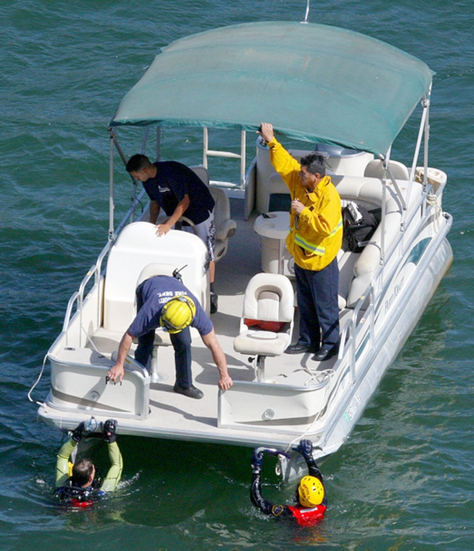 A SCUBA equipped diver and rescue swimmer were deployed into the lake during the search for Roberto Barrios,
36, of Glendale. Barrios’ body was found Monday morning at 11:35am. (Photos courtesy Sebastian Ramirez)